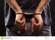 Close-up-arrested-man-handcuffed-26163005.jpg